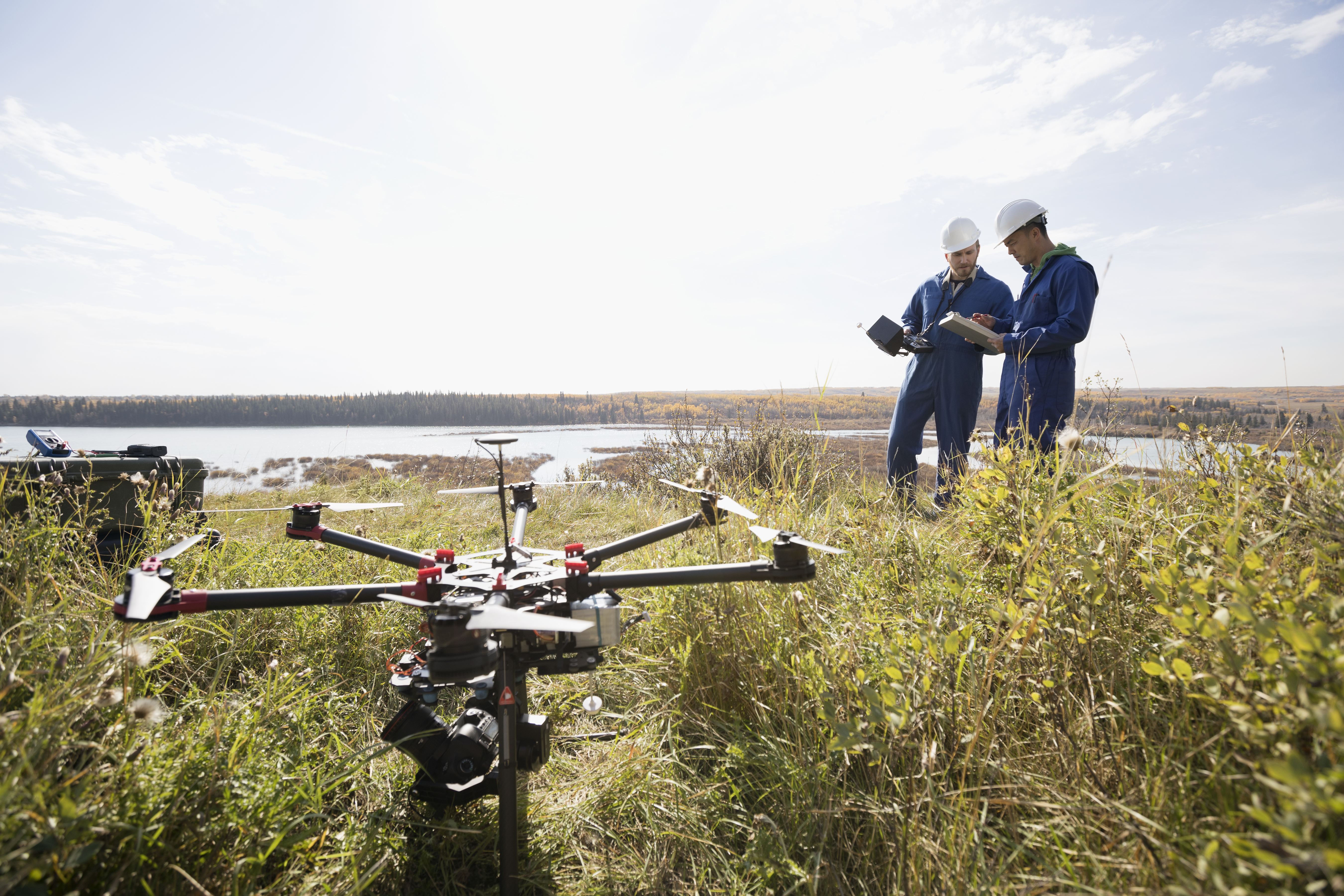 Workers working with drone equipment