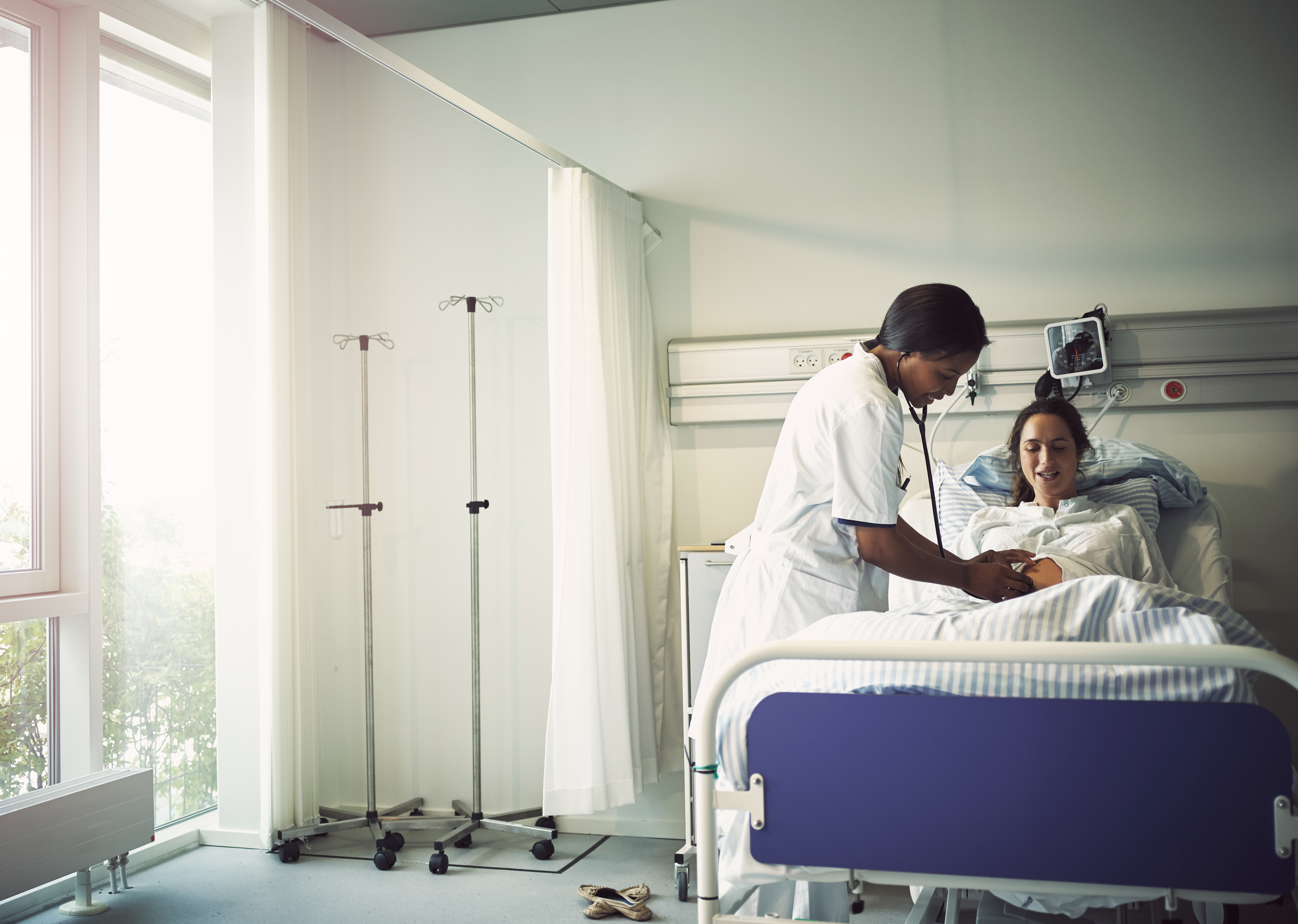 Nurse monitoring patient in Denmark