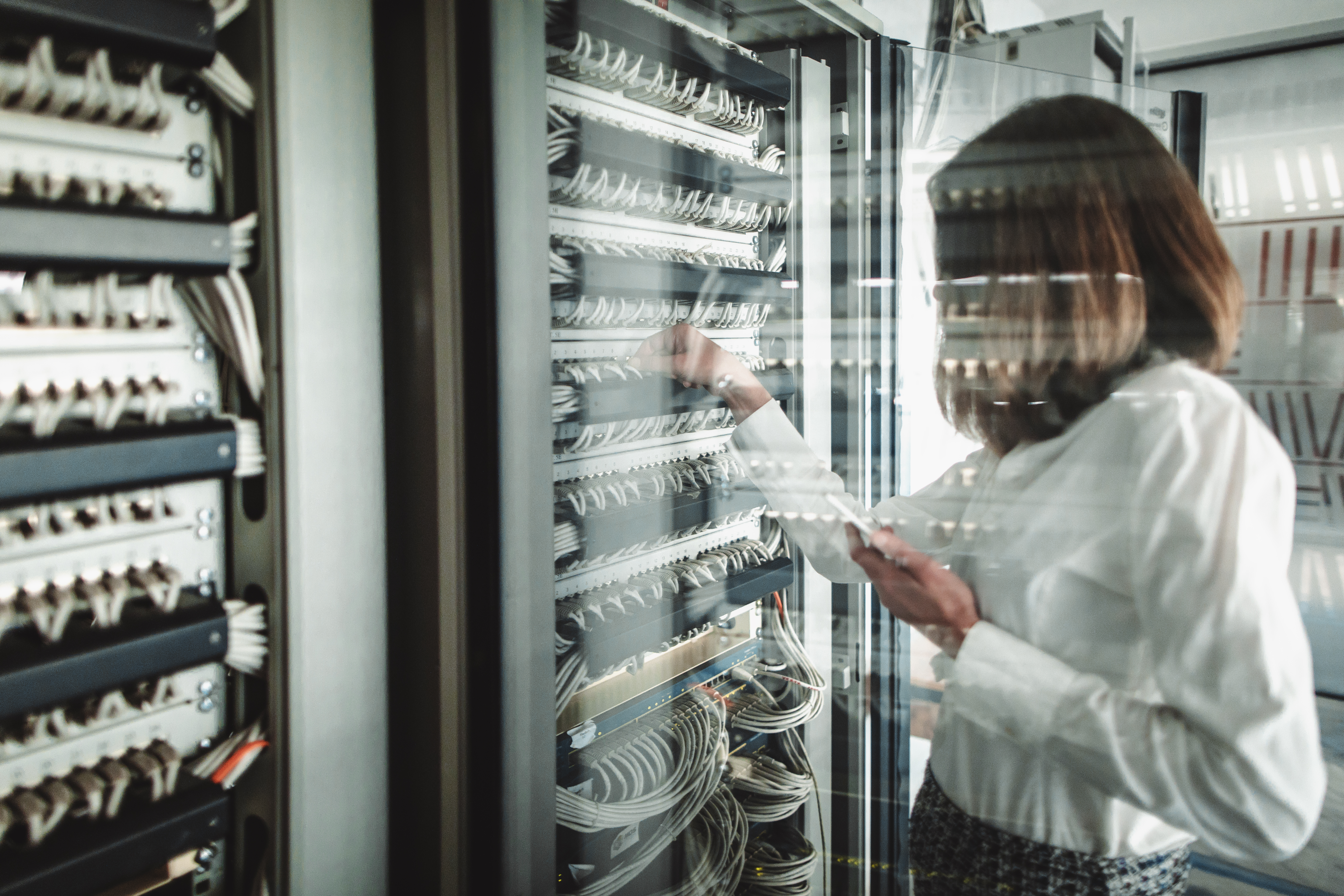 Busy women in a server room