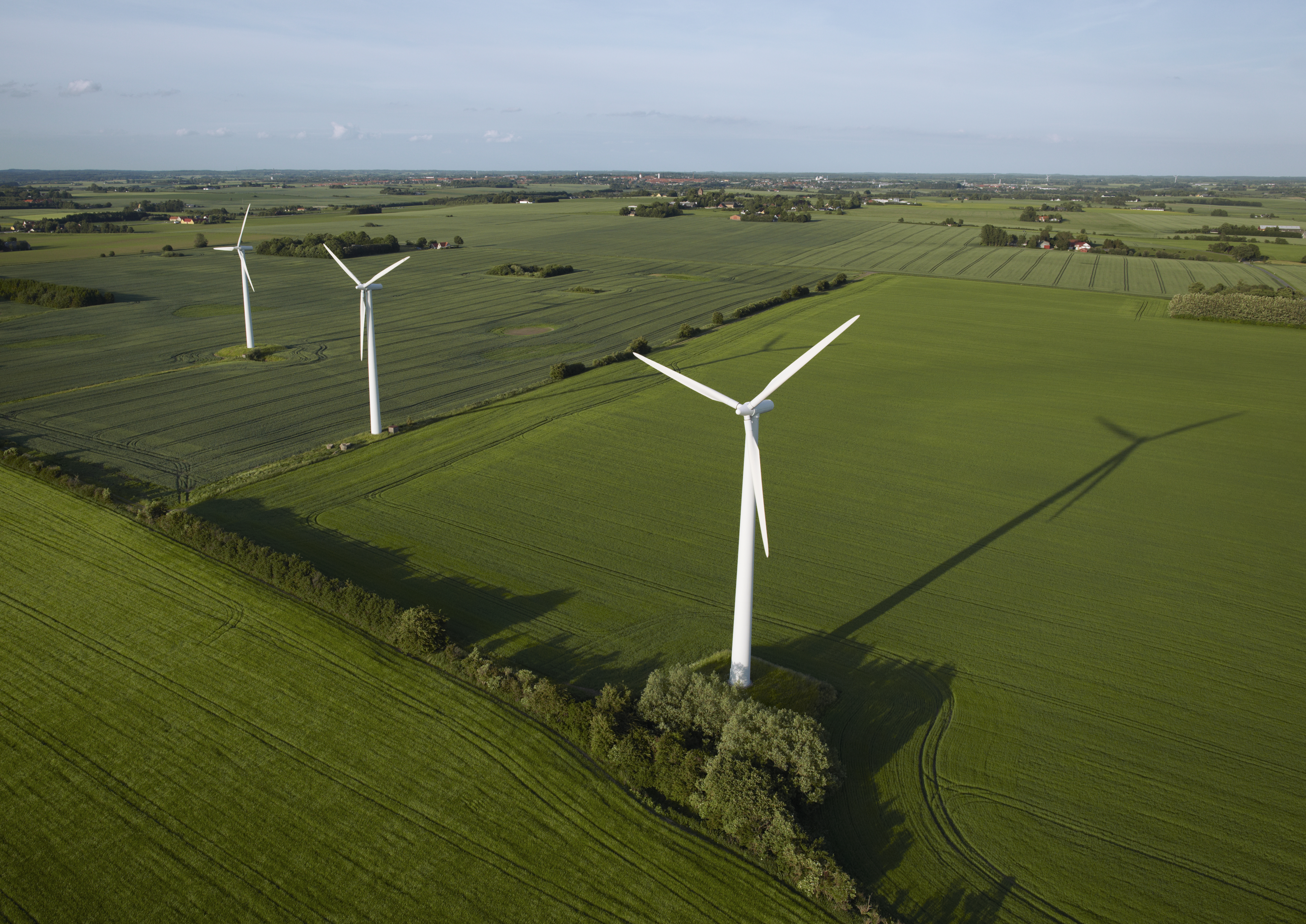 Row of windturbines located in a farmers field