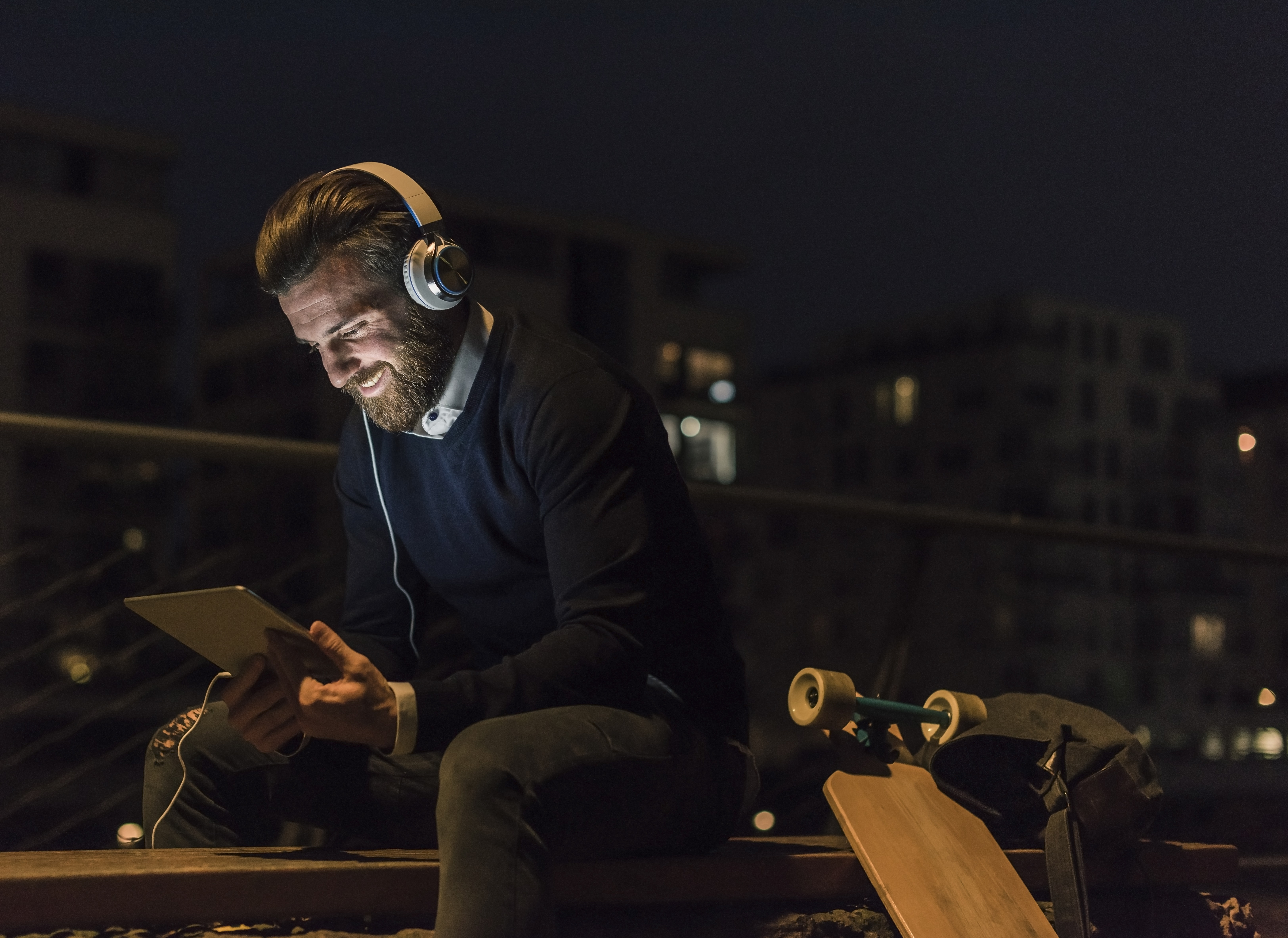 Smiling businessman with tablet