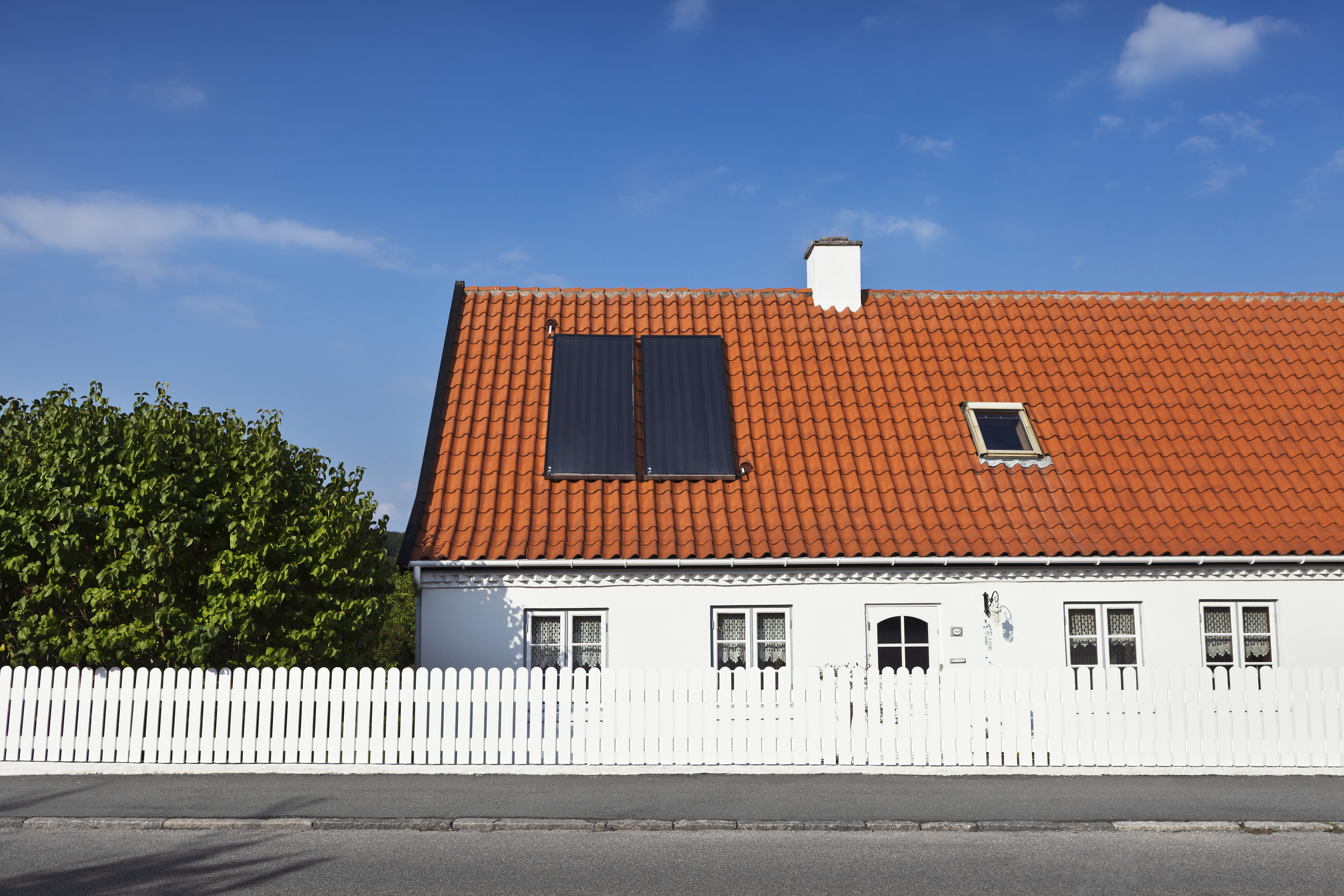 House with solar heating panels