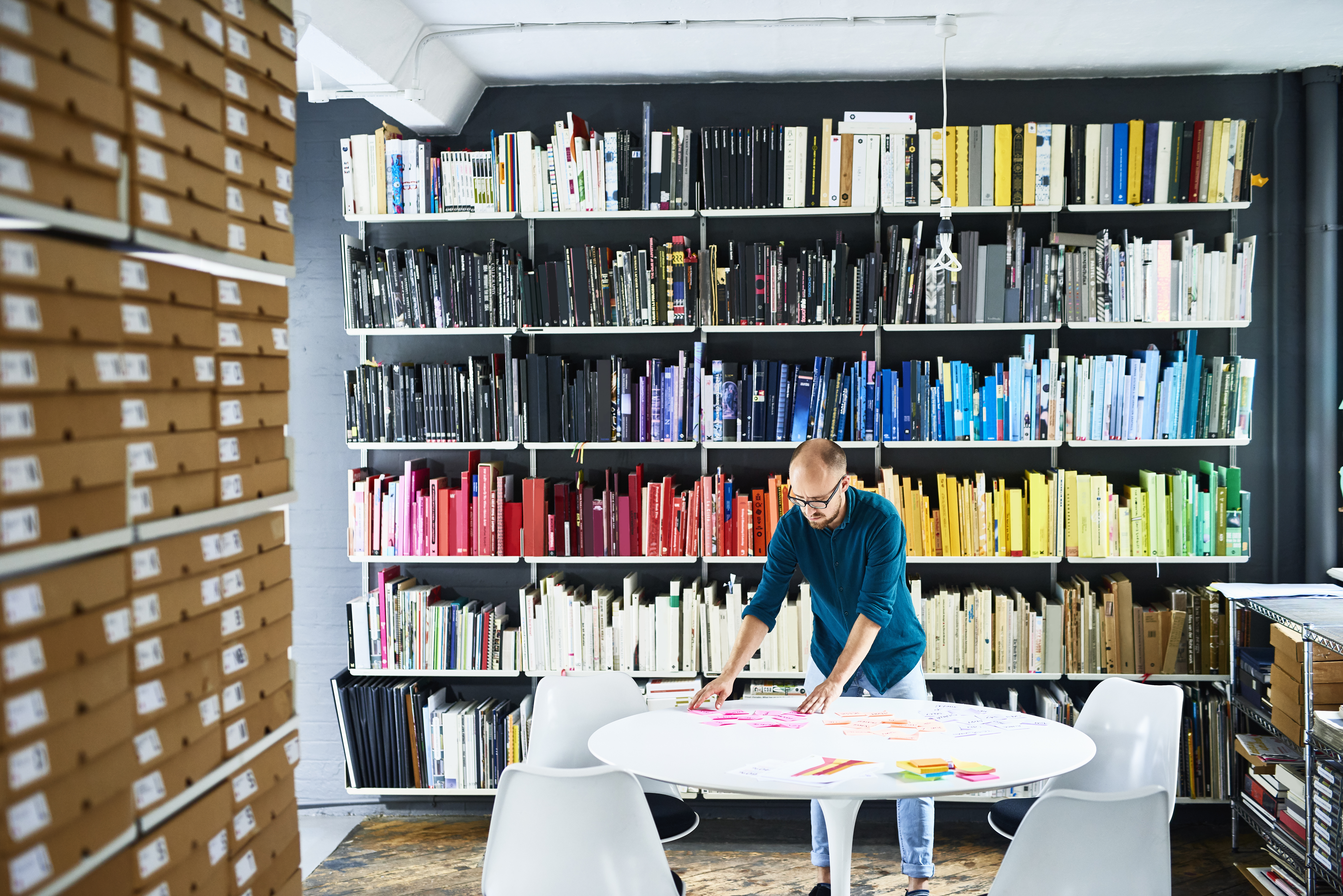 Businessman working in a colourful creative studio
