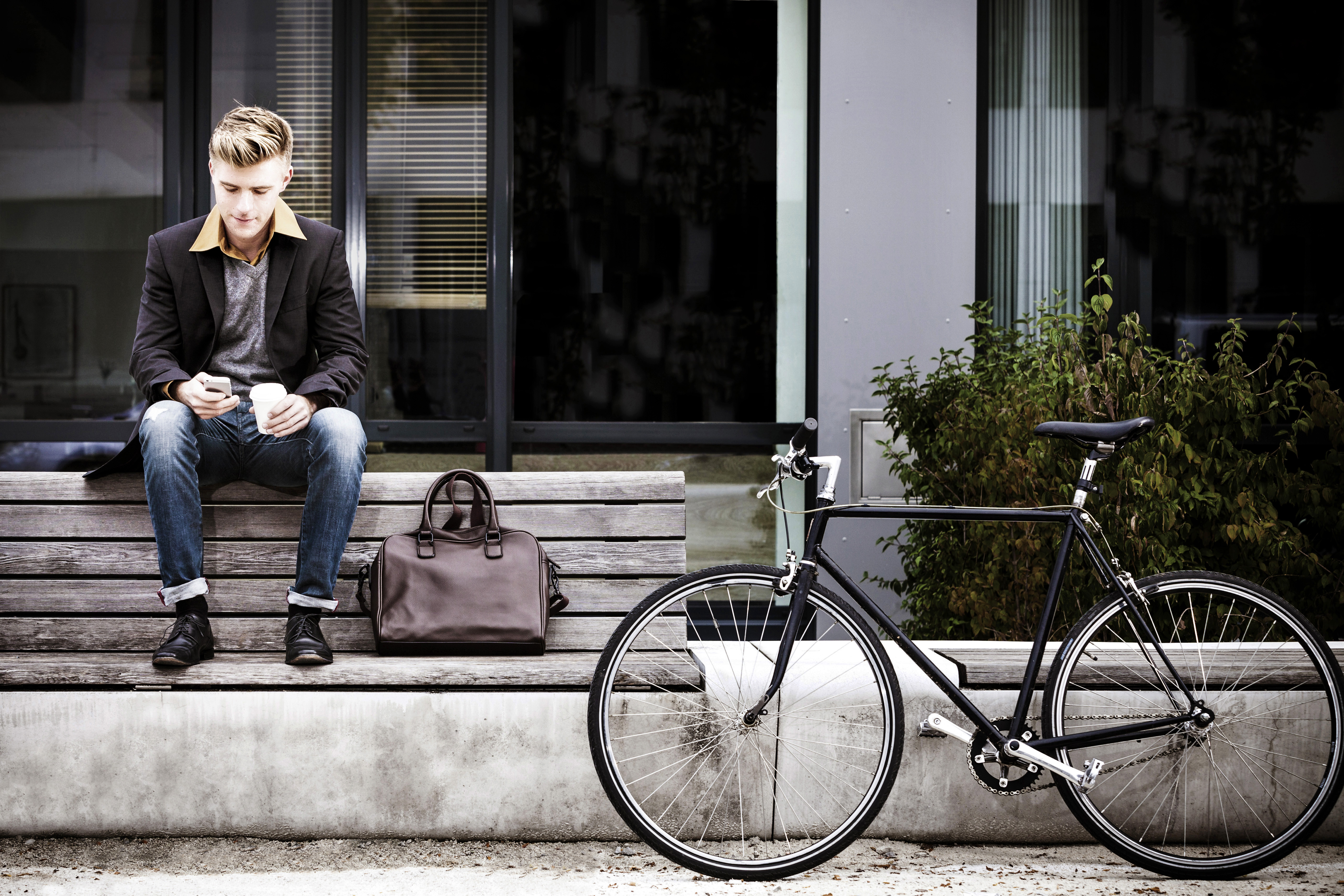 Young businessman using his phone in Copenhagen