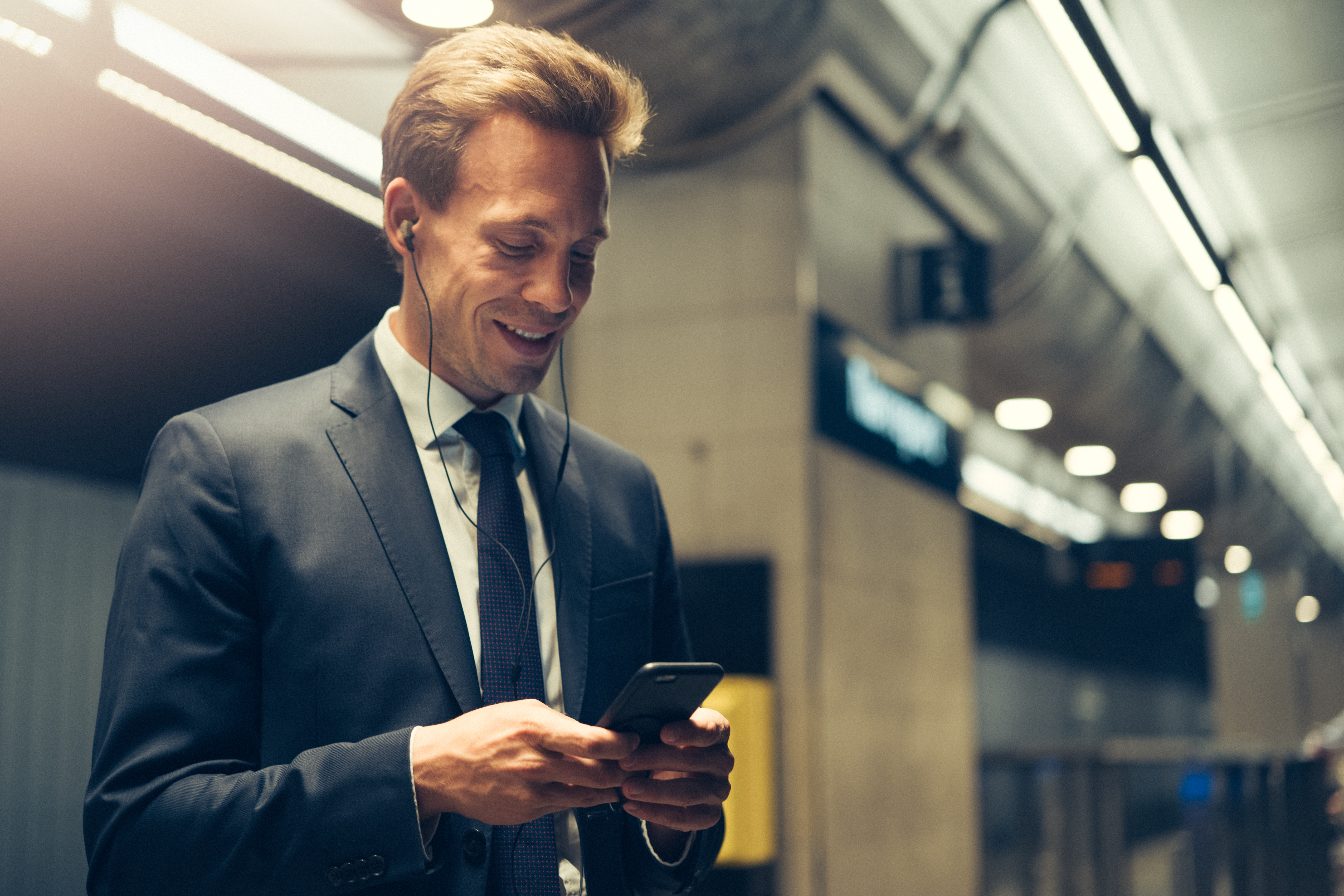 Fintech man in suit with phone